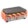 Icône 3D d'un appareil à raclette orange avec ses coupelles de fromage
