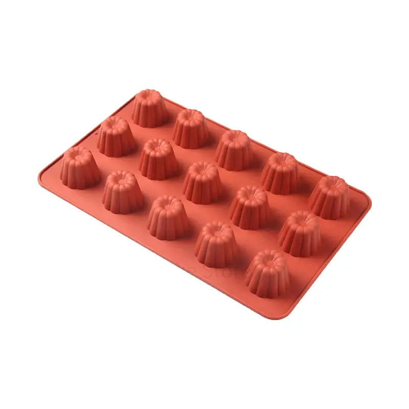 Moule en silicone rouge comportant 15 cavités en forme de cannelés, idéal pour réaliser des pâtisseries traditionnelles.