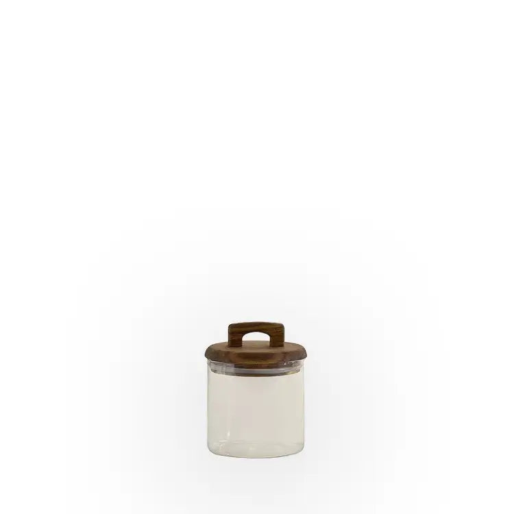Un petit contenant de rangement transparent avec couvercle en bois et poignée